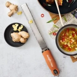 Microplane Premium Classic Series Zester/Grater Cinnamon Orange (46823) 8 Microplane Premium Classic Series Zester/Grater Cinnamon Orange (46823) -Kitchenknives Shop 46823e microplane premium classic series zester cinnamon orange 1