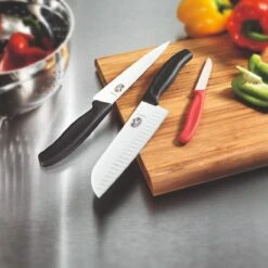 Victorinox Swiss Classic 17cm Santoku Knife Fluted Blade Orange (6852617L9B) -Kitchenknives Shop cut 6 8523 17 b1 1 santoku ls3 1 2
